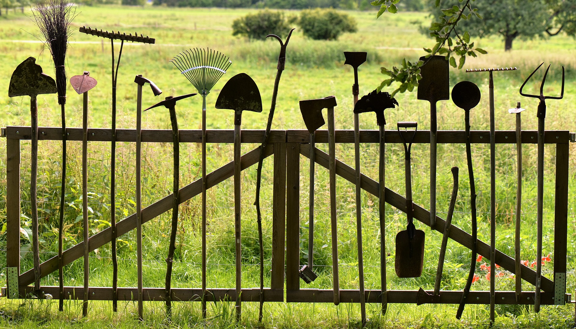 Garden tools on fence